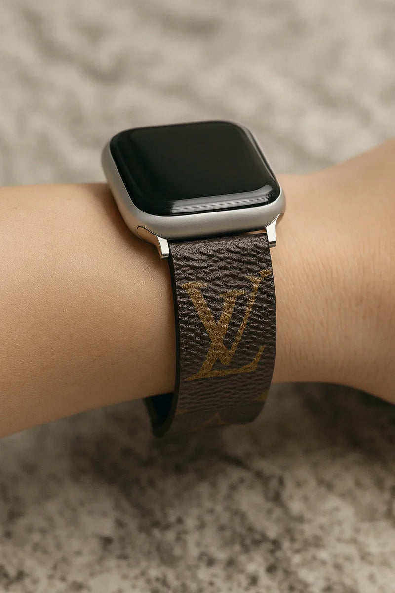 Close-up of an authentic repurposed designer Apple Watch band made from upcycled monogram canvas, highlighting the real texture and craftsmanship for the ‘Authenticity Matters’ guide.