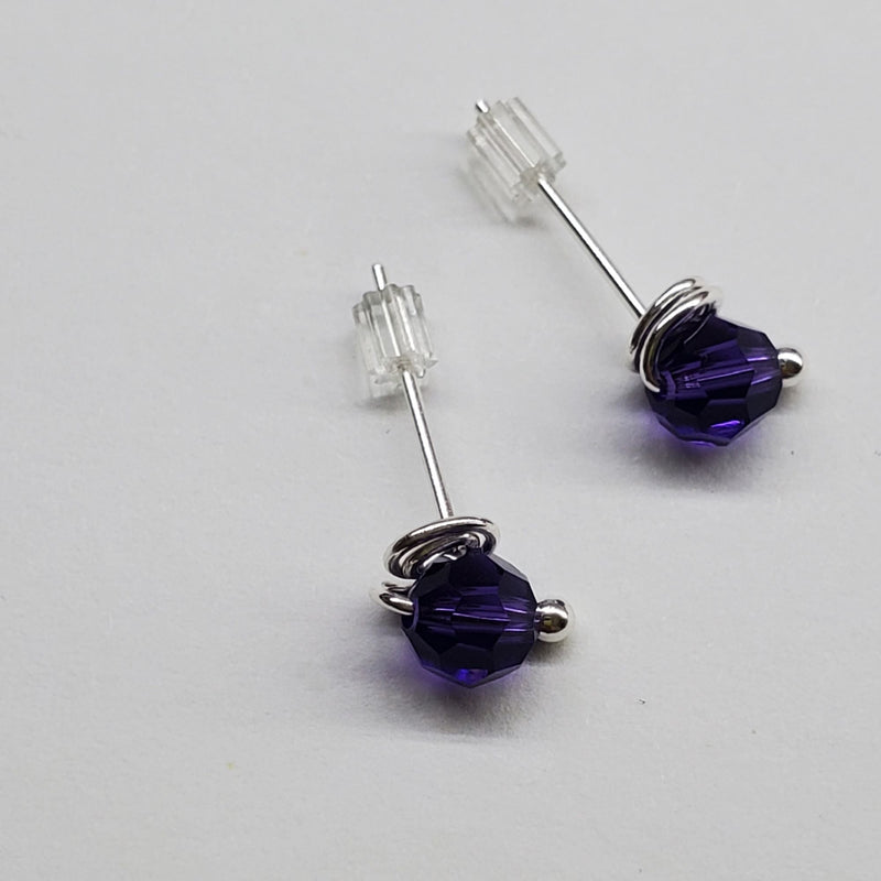 Purple sterling silver crystal ear studs laying on paper-Alexa Martha Designs