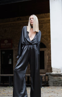 Bastet Noir Women's Jumpsuits & Rompers Plunging Neckline Jumpsuit With Elastic Waistband & Long Sleeves In Black Silk Satin