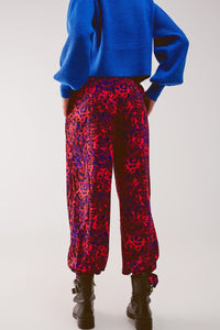 Q2 Pants Animal print belted straight leg pants in red