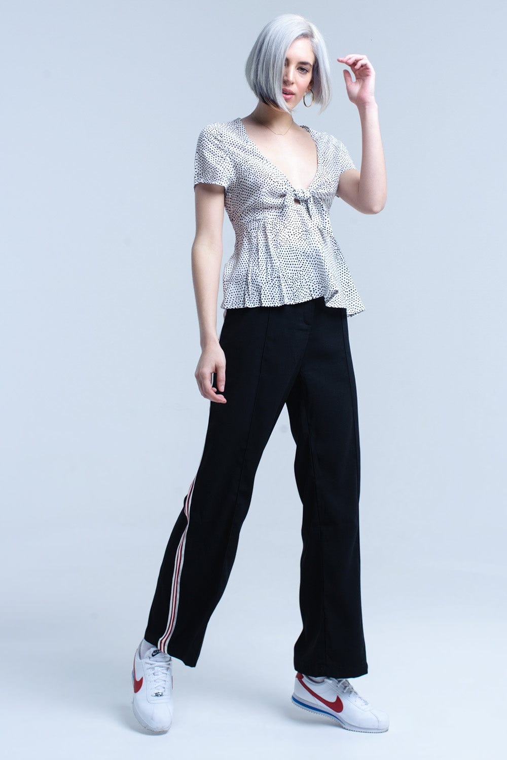 Q2 Women's Blouse White polka dot top with ruffle hem