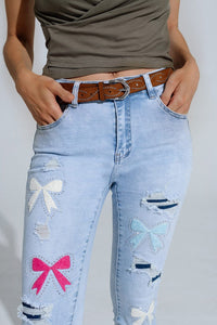 Q2 Women's Jean Light Blue Super Skinny Jeans With Bow Ties And Ripped Holes