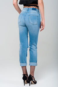 Q2 Women's Jean Ripped mom jeans with fishnet tights