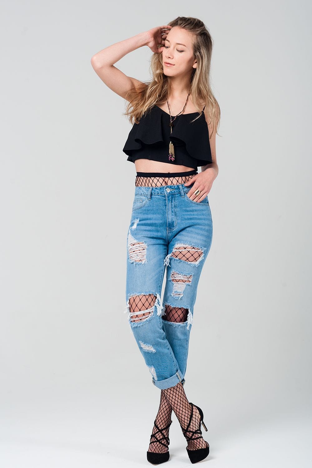 Q2 Women's Jean Ripped mom jeans with fishnet tights