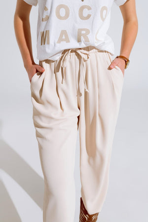 Q2 Women's Pants & Trousers Pants In Beige With Front Pockets And Drawstring Closing