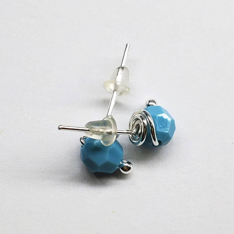 Turquoise sterling silver crystal ear studs laying on paper-Alexa Martha Designs